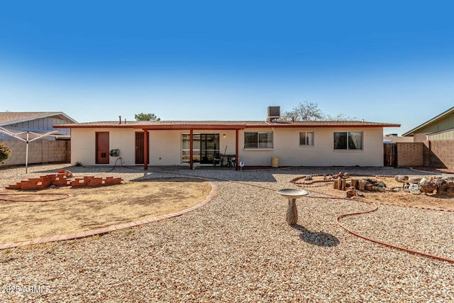 back of house with a patio area and fence