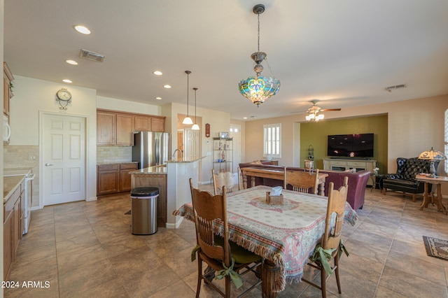 dining room featuring ceiling fan