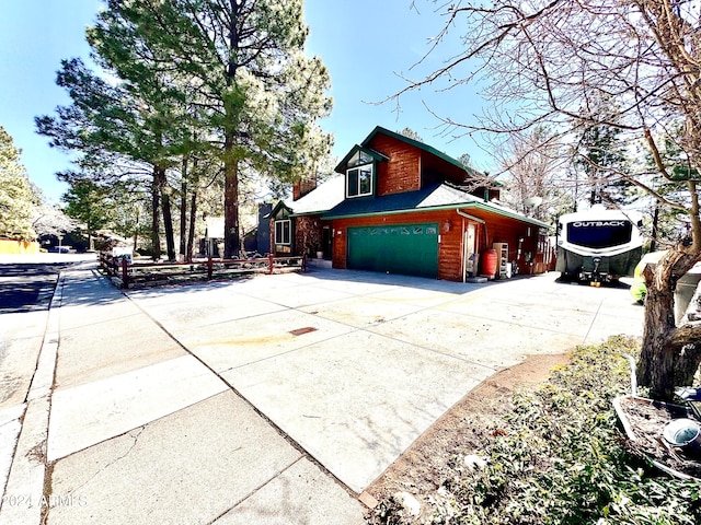 view of side of home featuring a garage