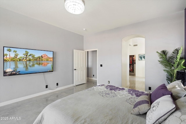 bedroom featuring concrete flooring