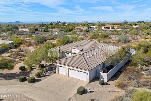 drone / aerial view featuring a mountain view