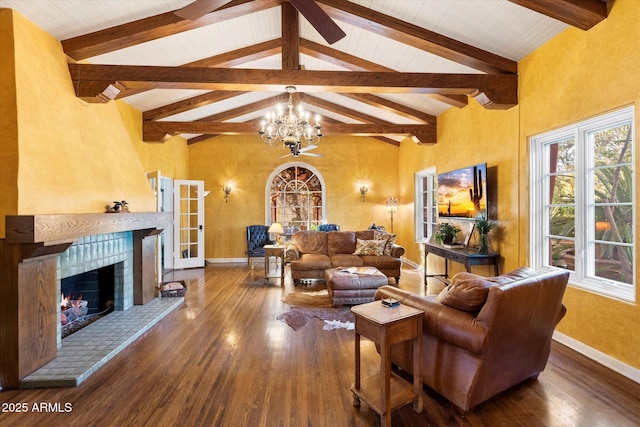 1614 Palmcroft Dr SW, Phoenix, AZ 85007 - living area with high vaulted ceiling, a notable chandelier, wood finished floors, and a fireplace
