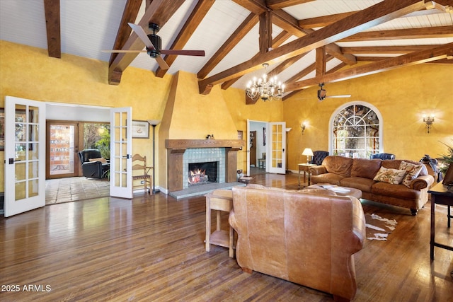 1614 Palmcroft Dr SW, Phoenix, AZ 85007 - living area with high vaulted ceiling, plenty of natural light, wood finished floors, french doors, and a tile fireplace