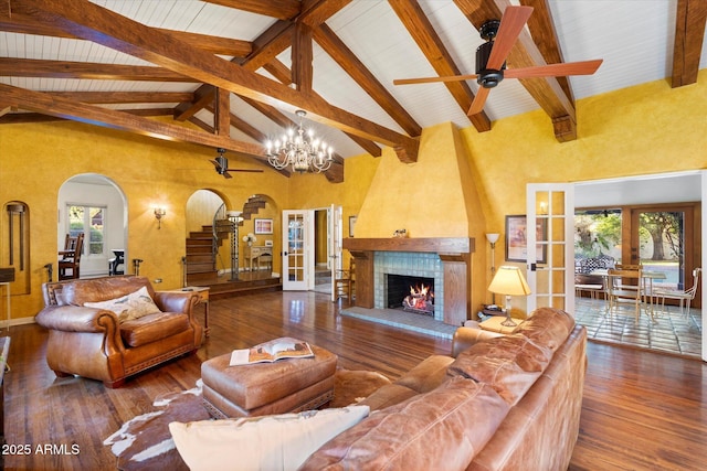 1614 Palmcroft Dr SW, Phoenix, AZ 85007 - living room with french doors, arched walkways, wood-type flooring, and a fireplace