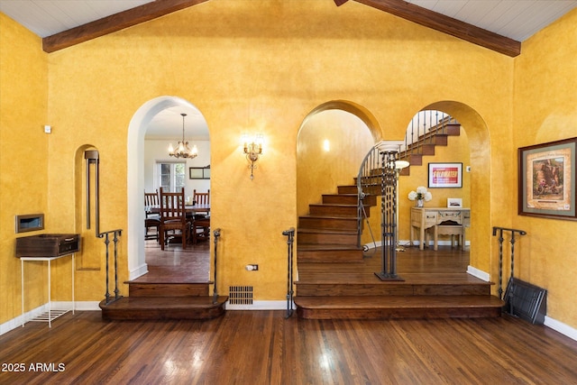 1614 Palmcroft Dr SW, Phoenix, AZ 85007 - stairs with beamed ceiling, arched walkways, visible vents, and wood finished floors