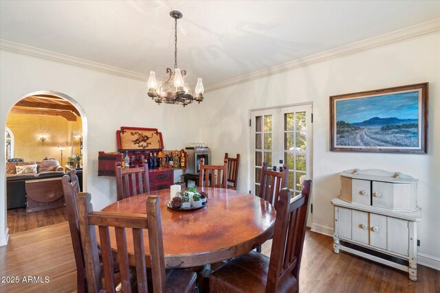 1614 Palmcroft Dr SW, Phoenix, AZ 85007 - dining room featuring crown molding, wood finished floors, arched walkways, and french doors