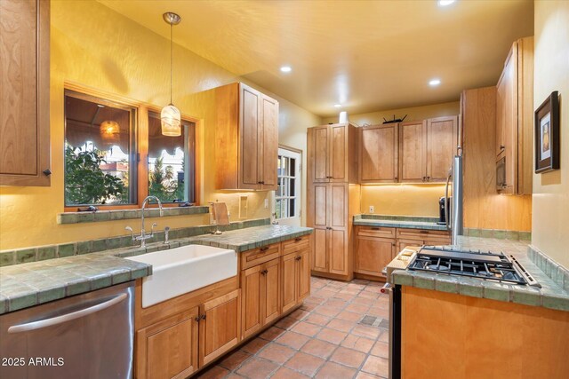 1614 Palmcroft Dr SW, Phoenix, AZ 85007 - kitchen with a sink, appliances with stainless steel finishes, a wealth of natural light, and pendant lighting