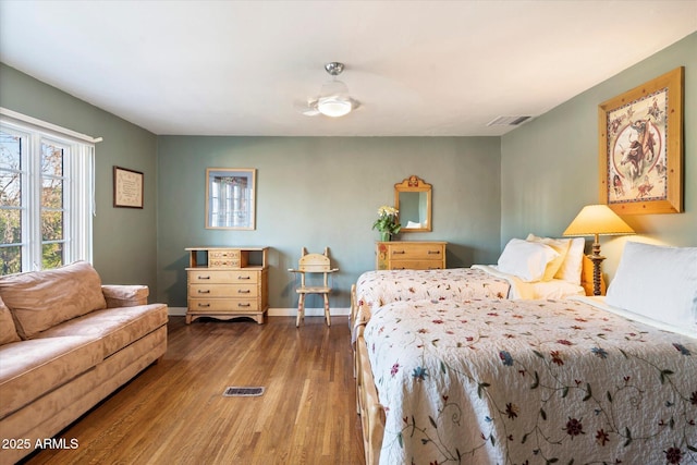 1614 Palmcroft Dr SW, Phoenix, AZ 85007 - bedroom with wood finished floors, visible vents, and baseboards