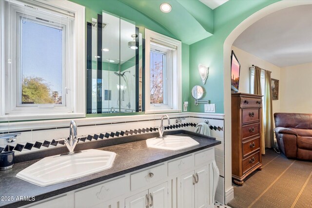 1614 Palmcroft Dr SW, Phoenix, AZ 85007 - bathroom featuring double vanity, a shower with shower door, and a sink