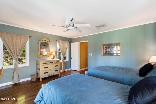 1614 Palmcroft Dr SW, Phoenix, AZ 85007 - bedroom with visible vents, multiple windows, baseboards, and wood finished floors