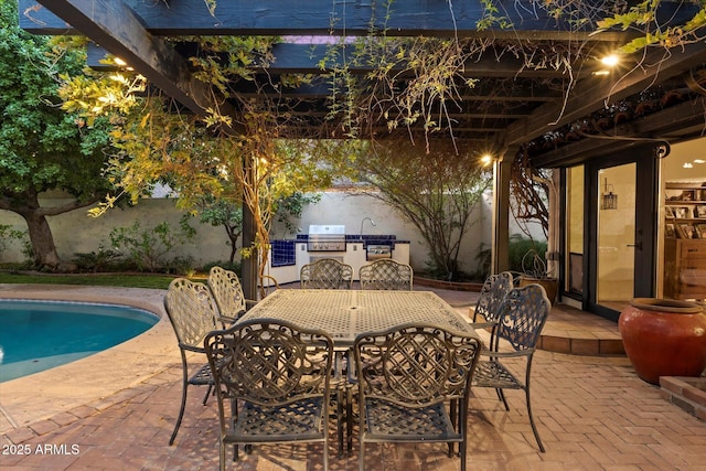 1614 Palmcroft Dr SW, Phoenix, AZ 85007 - view of patio with exterior kitchen, outdoor dining area, and an outdoor pool
