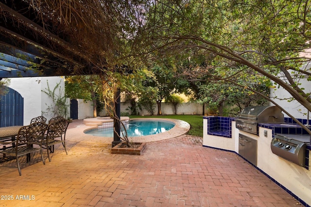 1614 Palmcroft Dr SW, Phoenix, AZ 85007 - view of pool with a patio area, area for grilling, a grill, and a fenced backyard