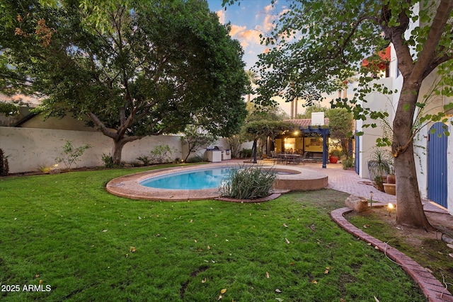 1614 Palmcroft Dr SW, Phoenix, AZ 85007 - pool at dusk featuring an outdoor pool, a yard, and a patio