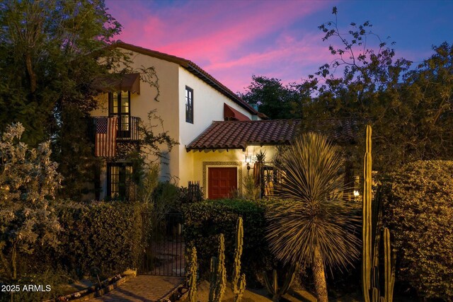 1614 Palmcroft Dr SW, Phoenix, AZ 85007 - view of front facade with a gate, stucco siding, a tile roof, and fence