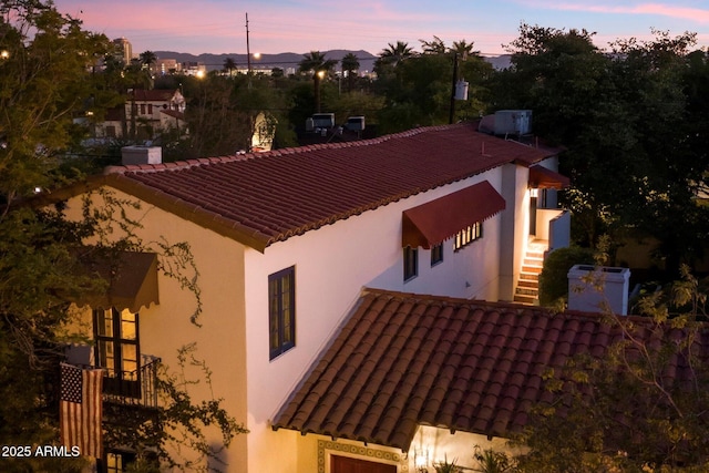 1614 Palmcroft Dr SW, Phoenix, AZ 85007 - property exterior at dusk featuring stucco siding and a tiled roof