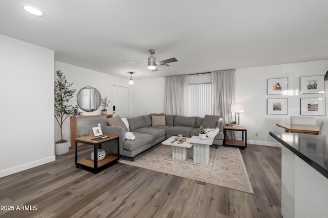 living room with recessed lighting, ceiling fan, baseboards, and dark wood-type flooring