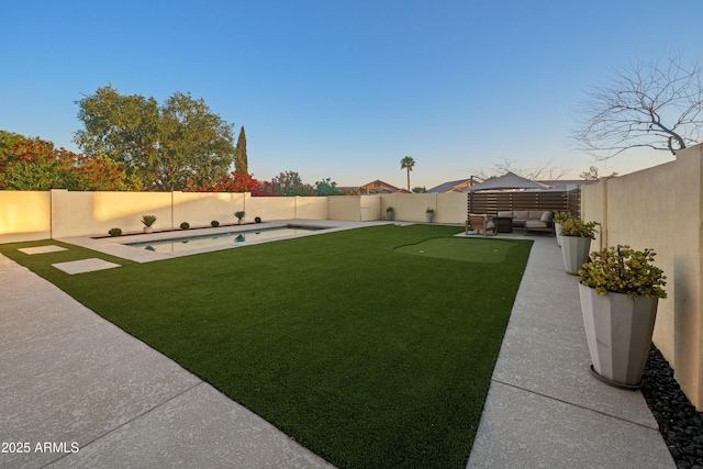view of yard with a fenced in pool, a patio, an outdoor living space, and a fenced backyard