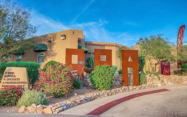 view of front of property featuring stucco siding