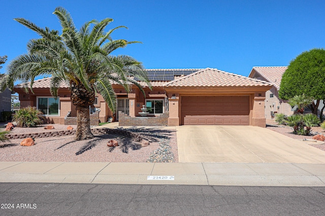 view of front of property with a garage