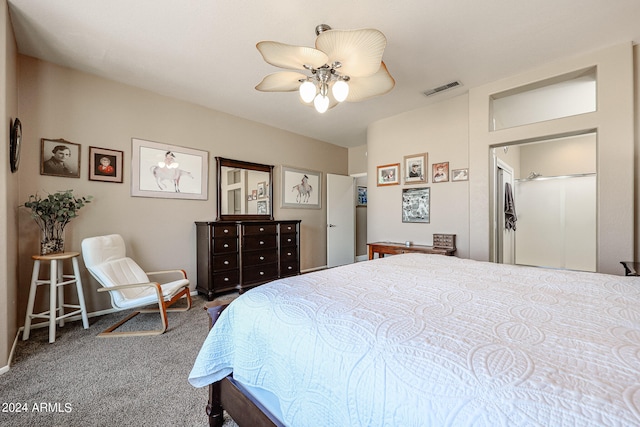 carpeted bedroom featuring ceiling fan and a closet