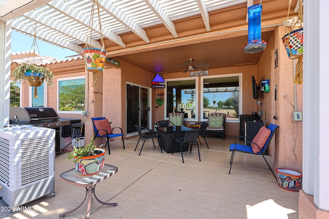 view of patio / terrace with ceiling fan, a pergola, and area for grilling