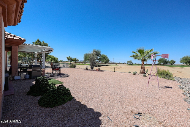 view of yard with a pergola and a patio