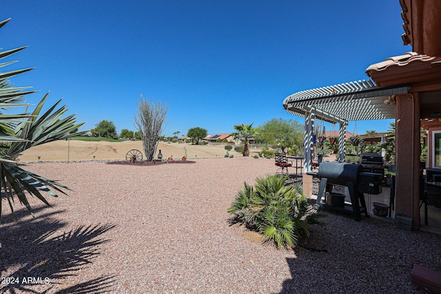 view of yard with a pergola and a patio