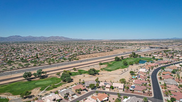 birds eye view of property with a mountain view