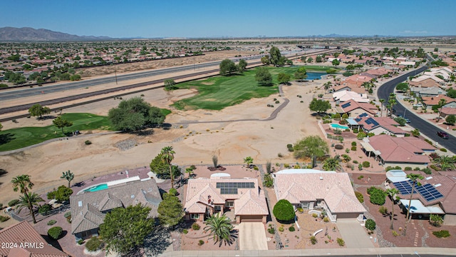 birds eye view of property with a mountain view