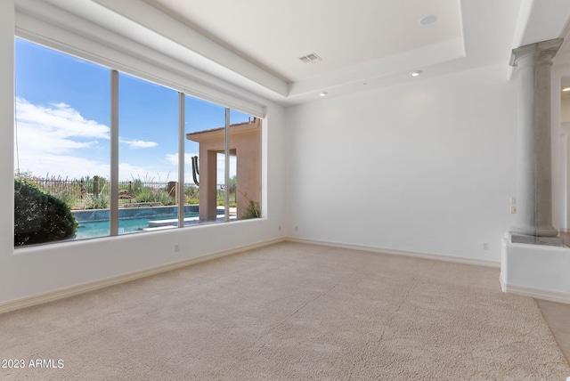 22463 N 54th St, Phoenix, AZ 85054 - carpeted spare room featuring decorative columns, a tray ceiling, recessed lighting, and baseboards