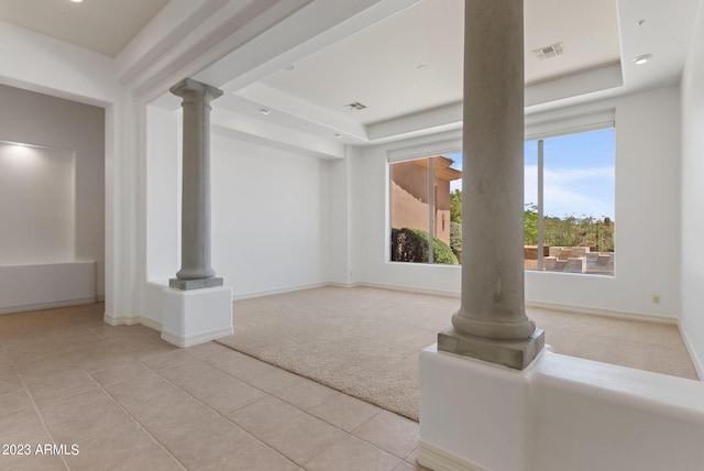 22463 N 54th St, Phoenix, AZ 85054 - unfurnished living room with light carpet, decorative columns, a raised ceiling, and light tile patterned floors