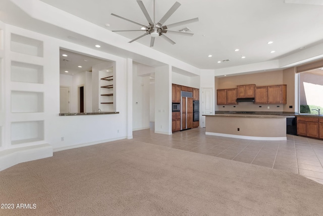 22463 N 54th St, Phoenix, AZ 85054 - unfurnished living room featuring light tile patterned floors, light colored carpet, ceiling fan, recessed lighting, and a sink