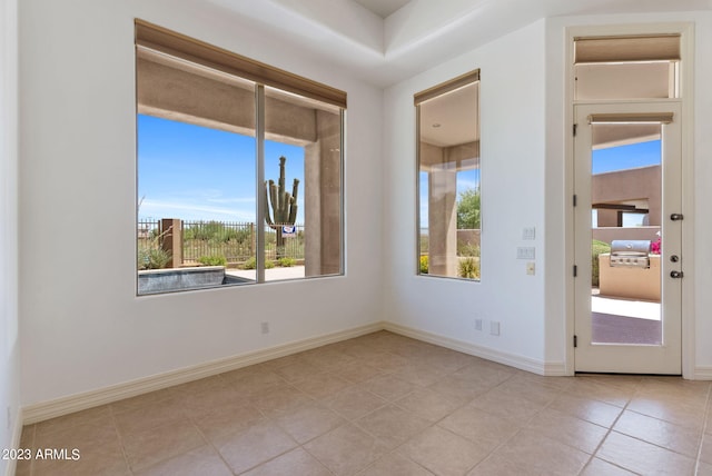 22463 N 54th St, Phoenix, AZ 85054 - tiled spare room featuring healthy amount of natural light and baseboards