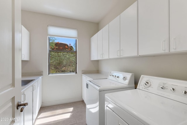 22463 N 54th St, Phoenix, AZ 85054 - washroom with independent washer and dryer, cabinet space, baseboards, and light tile patterned floors