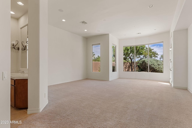 22463 N 54th St, Phoenix, AZ 85054 - empty room with recessed lighting, light colored carpet, a sink, and baseboards