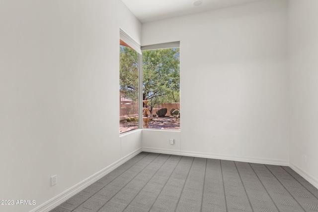 22463 N 54th St, Phoenix, AZ 85054 - carpeted spare room with plenty of natural light and baseboards