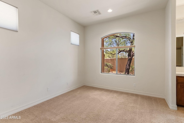 22463 N 54th St, Phoenix, AZ 85054 - spare room featuring light carpet, baseboards, and recessed lighting