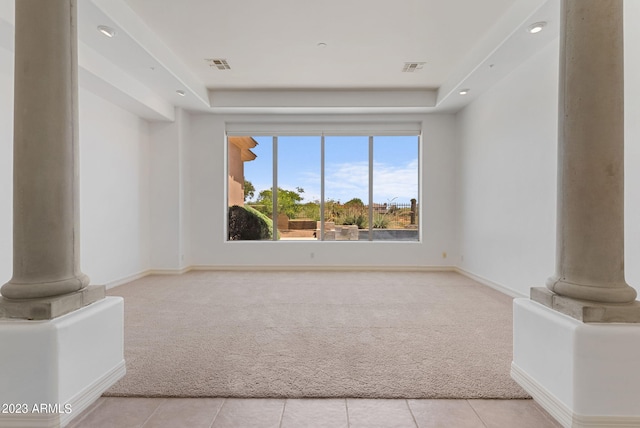 22463 N 54th St, Phoenix, AZ 85054 - unfurnished living room with light carpet, decorative columns, a tray ceiling, and baseboards