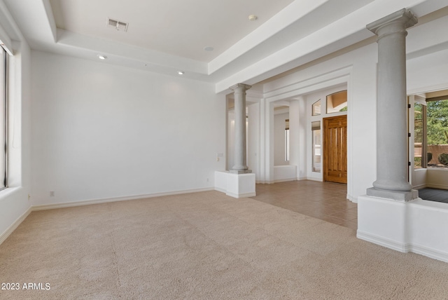 22463 N 54th St, Phoenix, AZ 85054 - carpeted empty room with ornate columns, baseboards, a raised ceiling, and tile patterned floors