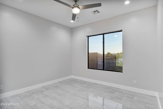 unfurnished room with ceiling fan