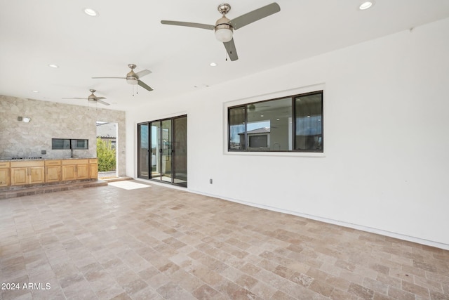 view of patio featuring ceiling fan