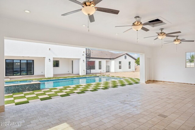 view of pool featuring ceiling fan