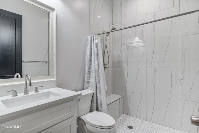 bathroom featuring walk in shower, vanity, and toilet