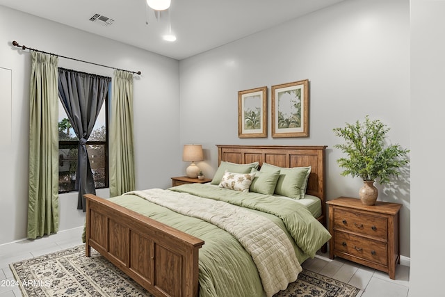 bedroom featuring light tile patterned flooring