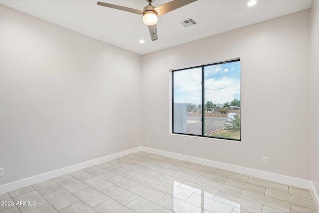 spare room featuring ceiling fan