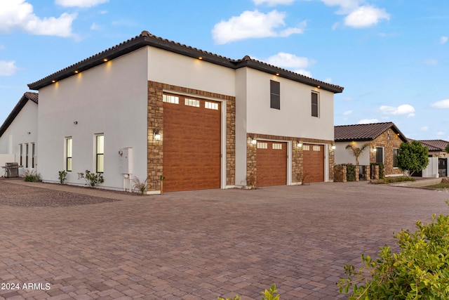 view of property exterior featuring a garage