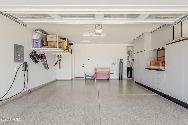 841 E Farmers Ln, Queen Creek, AZ 85140 - garage with electric panel, a garage door opener, and baseboards
