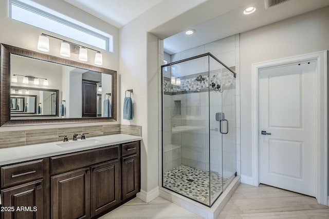 841 E Farmers Ln, Queen Creek, AZ 85140 - bathroom featuring a shower stall, vanity, backsplash, recessed lighting, and baseboards