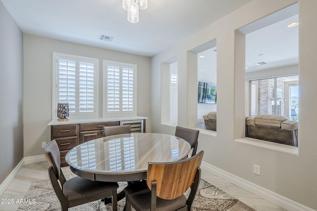 841 E Farmers Ln, Queen Creek, AZ 85140 - dining space with baseboards and beverage cooler