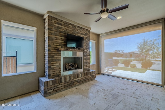 841 E Farmers Ln, Queen Creek, AZ 85140 - unfurnished living room featuring an outdoor brick fireplace, a ceiling fan, and stone tile floors